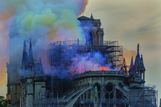 The roof fire spread with astonishing speed and at high temperatures. (The smoke’s tell-tale yellow tint is a result of the cathedral’s lead roofing and cladding vaporizing.)