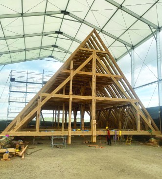 The full-scale nave frame raised at the Normandy worksite.