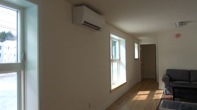 A view of the indoor head of the 9000-Btu Mitsubishi Mr. Slim mini-split heating and cooling unit for the 1000-square-foot VerMod unit. The Mr. Slim is the home's primary heat during the cold part of winter. In swing seasons, a heat pump booster on the building's "Conditioning Energy Recovery Ventilator" (CERV) carries most of the heating or cooling load.