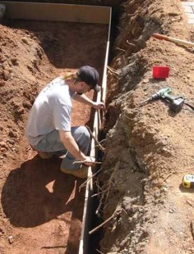 Footings are formed with 5/8-inch plywood.