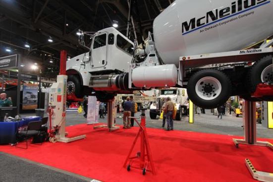 Stertil Koni's heavy
duty lift system can lift and amazing amount of weight. The units under this truck are battery powered and each can lift 22,000 pounds. I watched the thing go up and down a couple of times and lifting a concrete truck was no strain at all. Jay Leno has something like this in his garage (or maybe it should be "in one of his garages").
Click here to see it in action.