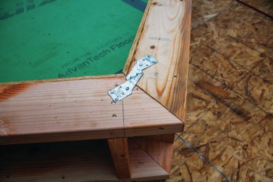 At the peak, where the fly rafters meet at a plumb cut, we add an RBC or an A35 clip to keep the overhang from opening as we lift. This keeps the plumb cuts on the trim nice and tight during lifting, too.