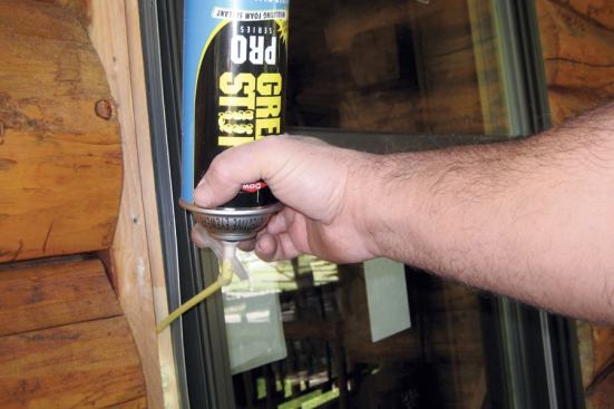 We fill the gap between the window and the framing with spray foam.