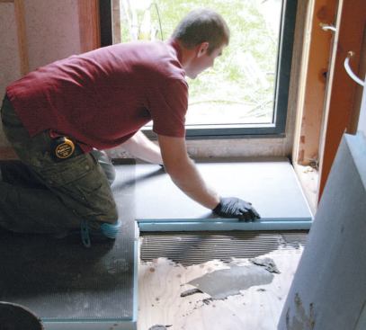 The waterproof base is installed with thinset mortar, and can be enlarged with interlocking base extensions.
