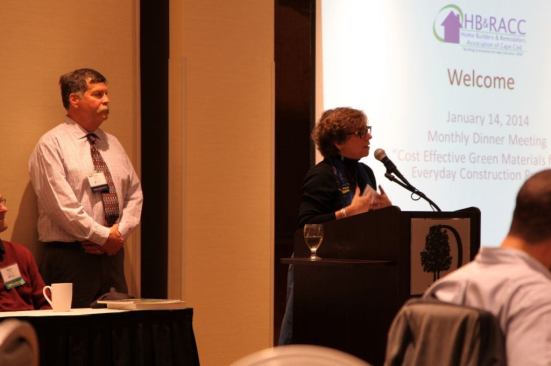 Executive Officer. Chis Duren, speaks to the group while President, Michael Duffy looks on.