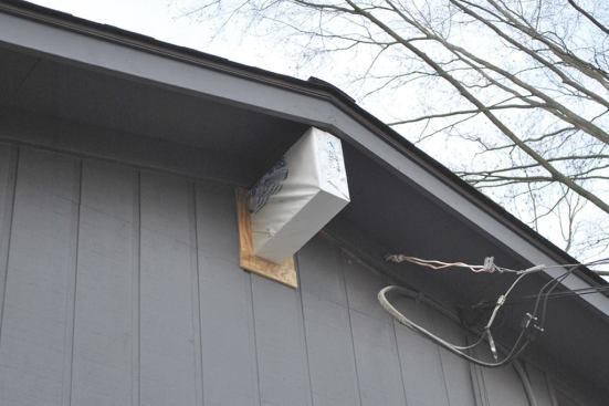The exterior was trimmed and stained to match the house siding.