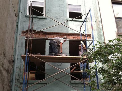 This is the first time we attempted to remove two stories worth of brick, but we expected the process would essentially be the same as past projects (see October 2014 JLC). The existing first-floor windows and wall framing were removed, exposing the three-wythe brick wall on the interior side. Next, we carefully removed enough of the outer brick course to fit the first structural steel channel for what would eventually be a built-up steel and 2-by flitch-beam assembly.