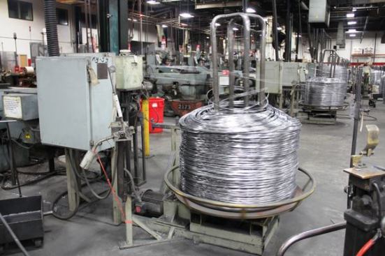 This wire is about to enter the machine that makes clipped-head framing nails. The machines for full round-head nails are in a different part of the plant. 
Click here for video.