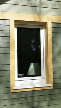 Hardiplank siding and Boral TruExterior trim cover the exterior of the Passive House.