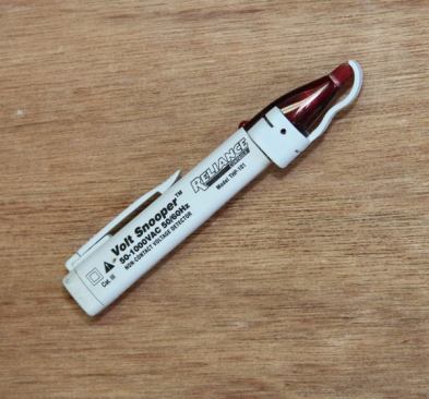 I used to plug in a power tool to see if the line was hot, but that was just silly. Now I use a Volt Snooper, a non-contact voltage detector that can be used to check outlets or wires we stumble across when opening up walls. You can stick the end of the device into a receptacle or clamp it around a wire. If the item is hot a light in the Volt Snooper will come on and it will emit a loud beep.