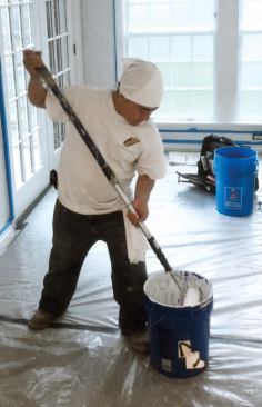We added 70-grit sand to Kilz 2 Latex stain-blocking primer and applied a coat to the entire substrate so it would grip the plaster.