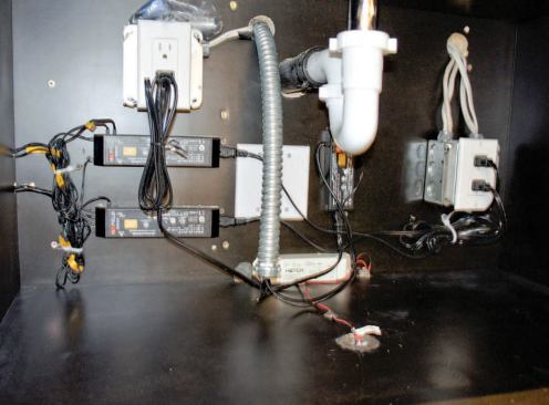 Drivers for the low-voltage LEDs are mounted in the cabinet under the sink.