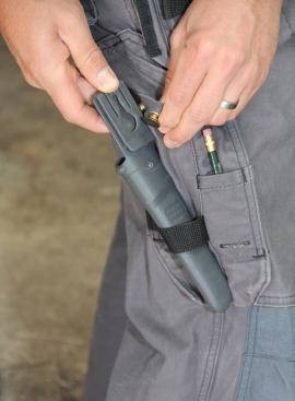 It turns out the button is designed to hold a sheathed work knife. The sheath clips onto the button…