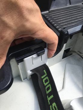 Clipping the shoulder strap to mounts found inside of the cord / hose housing provides a much more secure connection than mounting the strap to the side slides.