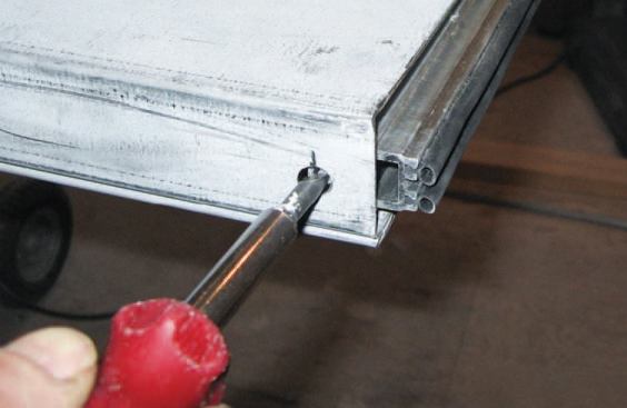 To function properly, the door bottoms need a flat threshold, so the author’s crew tacked strips of wood to the subfloor and filled the area with selfleveling underlayment.