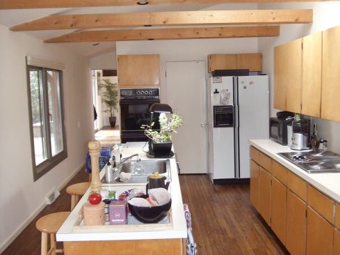 Part of the job was to open up the floor plan at one end of the house and replace the old, cramped kitchen ...