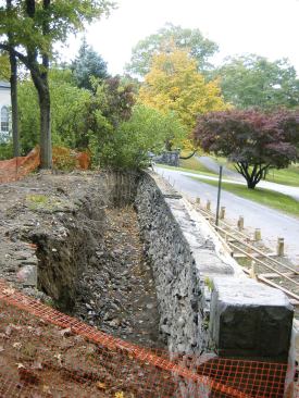 The wall's battered configuration - wider at bottom than top - increased its stability in the fully upright position.