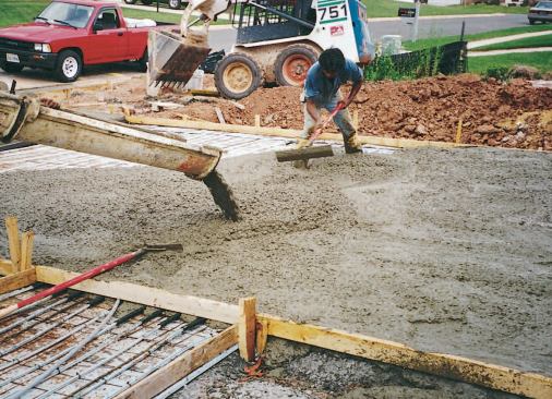 The author recommends against lifting the mesh and tubing up into the concrete during the pour.