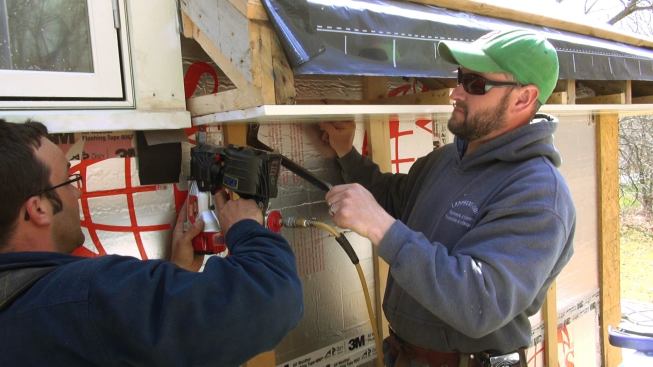 The third soffit board is persuaded into position then fastened. The three pieces were laid out so the outer board would have the same reveal as the inner board after the frieze and bed molding are installed on the wall.
