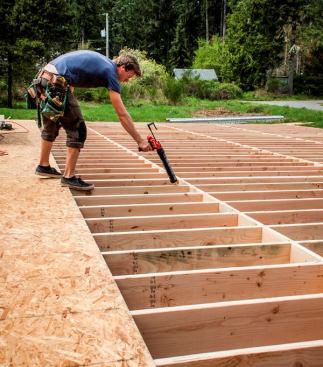 When configured for quart-tubes the M12 gun is heavier than the pneumatic caulk gun we normally use. But we like it better because it's easier to glue subflooring when you're not trailing a hose.