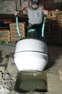 I fill the hole about a third of the way and tamp it with a shovel to remove air bubbles.