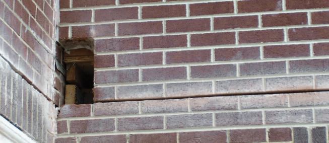 The crew made a hole to allow the 14-foot channel to pass inside at the second-floor level.