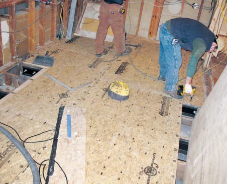 The old subflooring was replaced with 3/4-inch AdvanTech T&G sheathing glued and screwed to the framing.