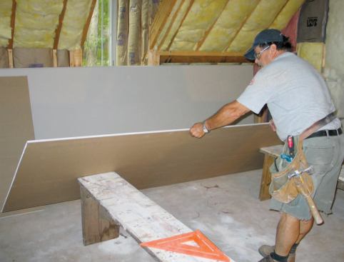 Otherwise, he uses two 18-inch-high benches as a work platform, tilting each panel against their ends and then dragging it on top.