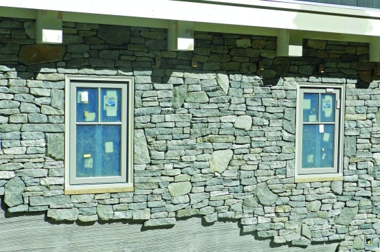 The mason artistically integrated both shapes into a consistent, beautiful whole. The larger stone had the effect of moving the eye along and breaking up any possible linear effects. The mason selected stone from each of the wood crates to create the pattern, cutting pieces as necessary. We used the same stone on the face of the fireplace, which nicely ties the inside and outside together.