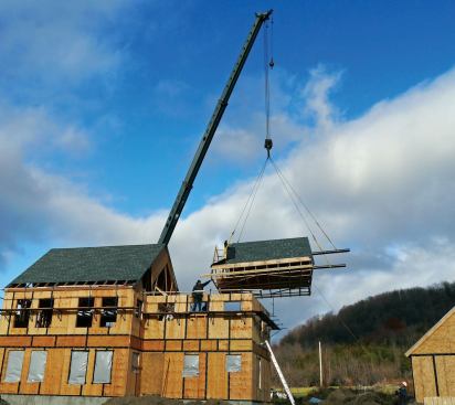 The smaller roof was hoisted on two 8-inch round pipes. Probably due to its lighter weight (less than 1 1/2 tons), this roof dodged back and forth before settling down.