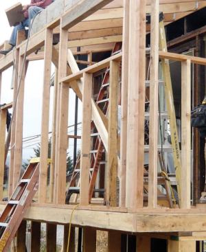 The back laundry room was rebuilt with optimum value engineering (OVE) framing, a method that reduces thermal bridging and saves material. With OVE framing there is 24-inch stud spacing, a single top plate, two-stud corners, right-size headers, and no jack studs.