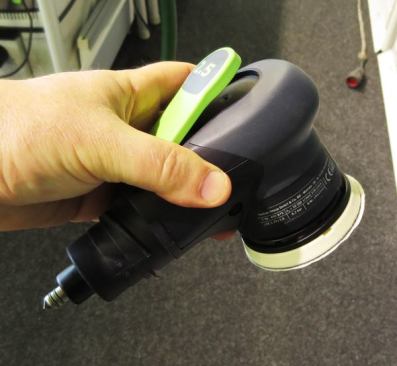 Festool pneumatic sanders are available in the U.S., though not this particular model—which takes a 3-inch disk. Note the unusual air fitting; it plugs into a supply port integrated into the dust extraction hose.