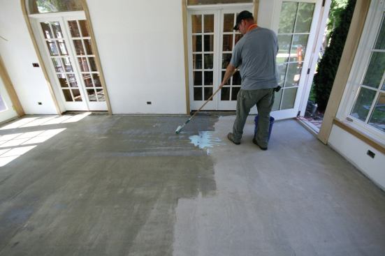 The primer was rolled out with a 3/8-inch roller on a clean slab.