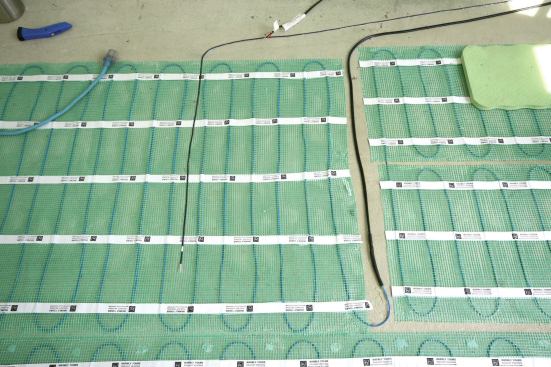 An in-floor sensor probe was run to the thermostat so the radiant mat could be controlled by the temperature of the floor, as well as by ambient air temperature.