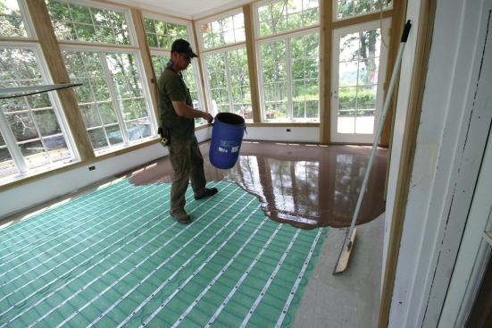 The grid of screws helped guide where to dump the buckets of underlayment mix to evenly distribute it.