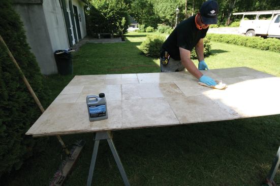 Once the polished stone was cleaned of dust, the crew pre-sealed it.