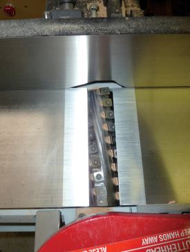 Spiral cutter heads with indexed carbide cutters are more expensive, but they prevent chip-out and tear-out.