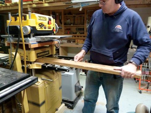 After the jointer, the board is run through a powerful thickness planer that quickly hogs material off the rough side. It takes several passes before that side is smooth enough to be run through a less powerful, but more precise planer.