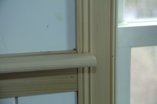 The author left the cap a little long and set it on the rail. He marked the length, as well as where the cap returned to the wall.