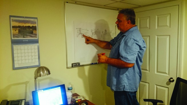 The crew looked at drawings and photos of how certain high-performance  details had been executed on previous projects (top). They not only asked  questions about the details, but also offered suggestions for how they  might improve on how the details were built.