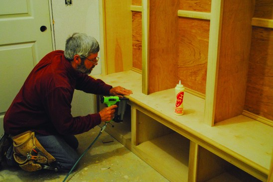 A large back-band molding with a rabbeted edge fits around the edge of the seat; a bullnose softens the edge.