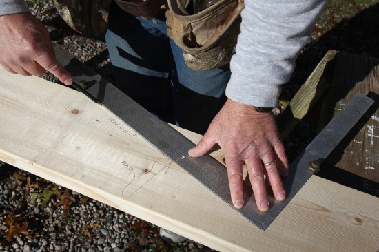 Place the square on the opposite edge of the board and draw the level line for the seat cut (labeled for clarity).