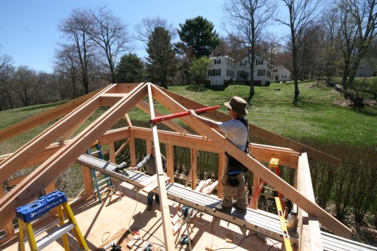 If installed properly the roof plane should be perfectly flat between the hip rafters and the kings.