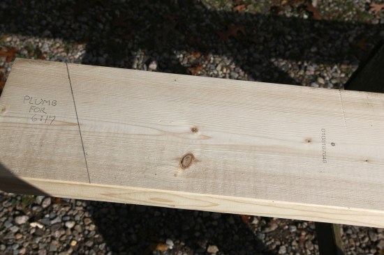 Flip the square to the other side of the rafter stock and finisht drawing the line for the plumb cut (labeled here for clarity).