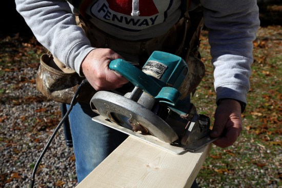 For the initial cheek cut, set the saw blade angle to 45°, and saw completely through the rafter stock.