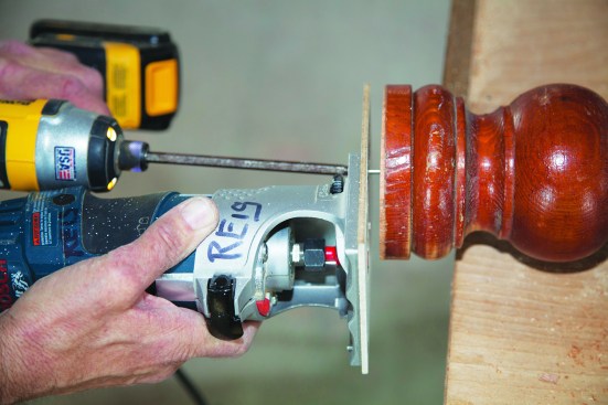 Then he screwed the router to the newel at the pivot point.