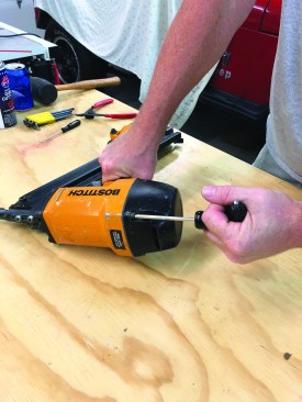 First, remove the four machine screws that secure the cylinder cap to the main frame.