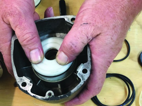 Slip the assembly into the cylinder cap, pressing gently with your thumbs.