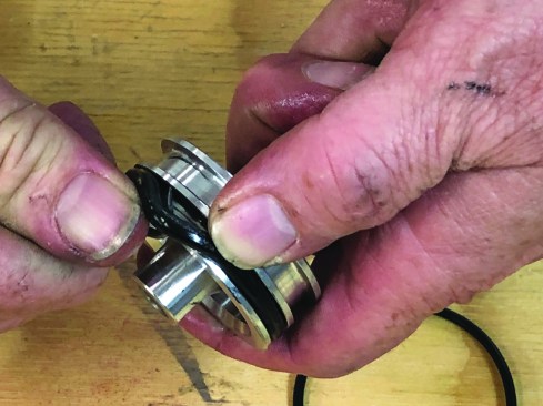 The driver-piston assembly consists of the piston head attached to the driver. Remove the old O-ring.