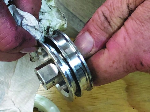 Thoroughly clean all dirt and old lubricant from the O-ring groove.